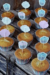 Homemade cupcakes on the wooden background