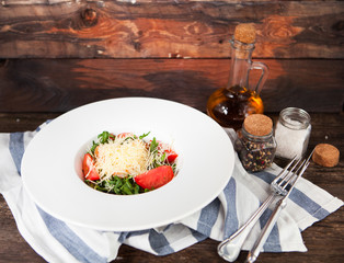 Tomato salad with basil, cheese, olive oil and garlic dressing,