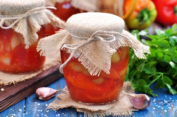 Pickled peppers in tomato juice with onions, garlic and basil.
