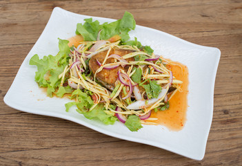 Fillet topped with a spicy dressing.
