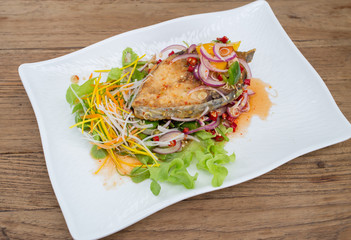 Fillet topped with a spicy dressing.