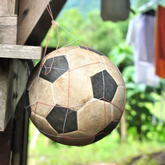 Old football on net in rural scene