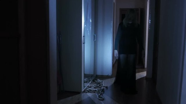 ghost girl in the house. the spirit of a woman. Horror scene of a scary woman