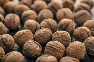 Walnuts on a wooden background