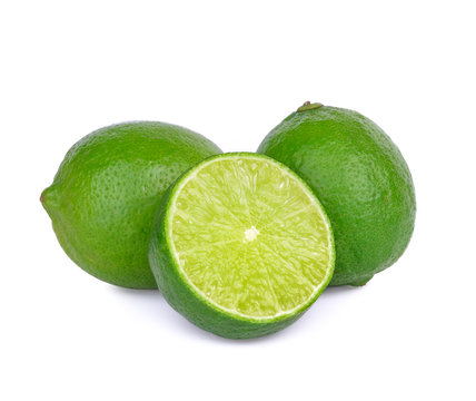 Limes with slices isolated on white