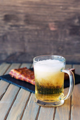 Grilled bbq smoked pork ribs on black slate board