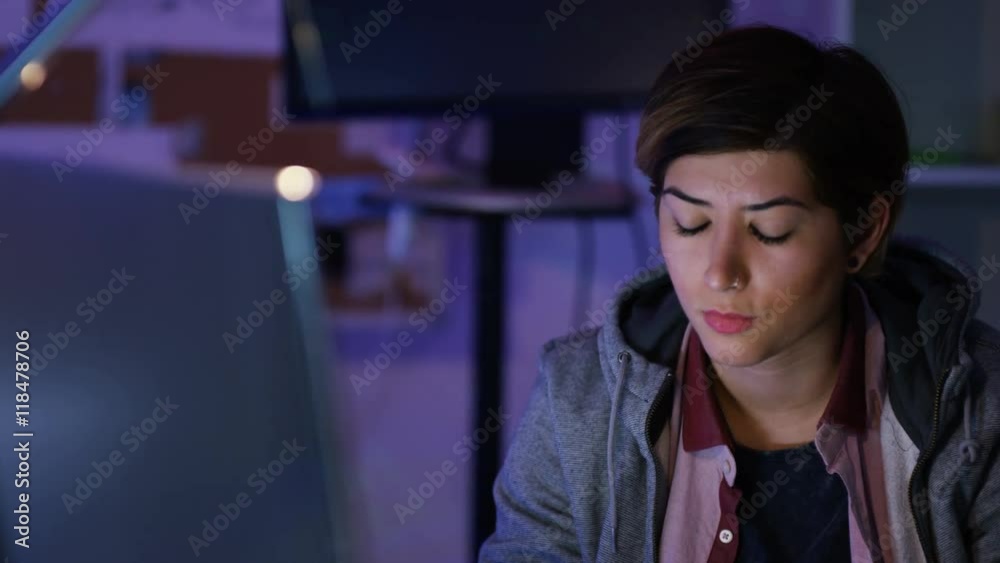 Wall mural young computer hacker trying to gain access to a computer system