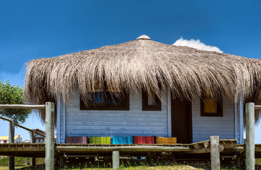 Fototapeta na wymiar Typical brightly colored houses in Punta del Diablo, Uruguay
