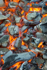 Burning coal. Glowing embers smoldering in the fireplace