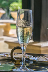 A refreshing glass of white wine on a bright sunny day