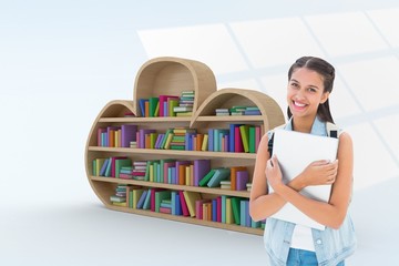 Composite image of student holding laptop