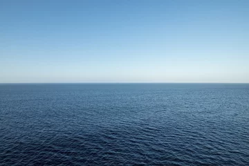 Fotobehang High view over an ocean horizon on a clear day © klikk