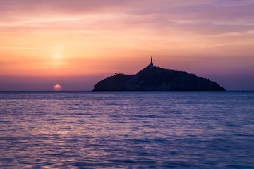 Sunset view of a lighthouse in an island - Santa Marta, Colombia - obrazy, fototapety, plakaty