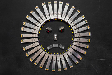 Electrical internet SFP network modules for network switch as the shape of face  with red diodes on...