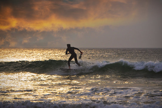 Man Riding Wave at Sunset  - Atlantic Ocean 