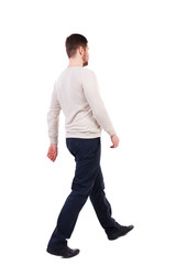 Back view of walking businessman.  Rear view people collection. Backside view of person. Isolated over white background. The bearded man in a white warm sweater is sitting diagonally. 