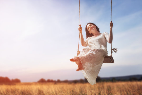 Young Woman On A Swing