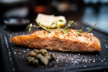 Salmon steak served on a warm plate