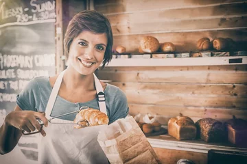 Fotobehang Mooie serveerster die croissant ophaalt? © vectorfusionart