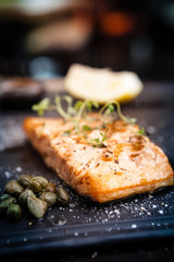 Salmon steak served on a warm plate