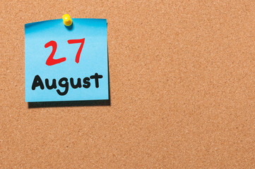 August 27th. Day 27 of month, color sticker calendar on notice board. Summer time. Empty space for text