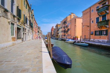 Venice, Italy, June, 21, 2016: landscape with the image of boats on a channel in Venice, Italy