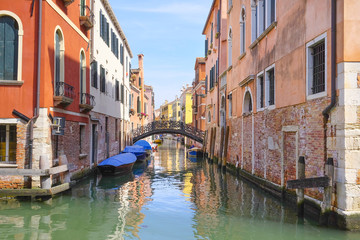 Fototapeta na wymiar Venice, Italy, June, 21, 2016: landscape with the image of boats on a channel in Venice, Italy