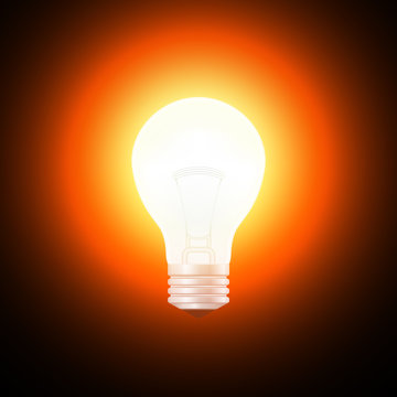 Realistic light bulb on a black background