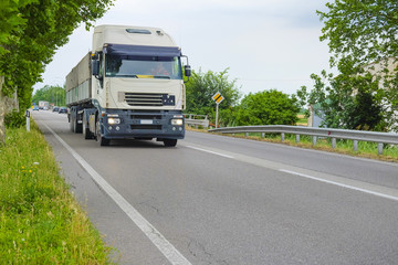 Fototapeta na wymiar Rovigo, Italy - June, 28, 2016: truck on a highway in Rovigo, Italy