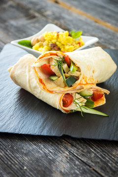 Delicious homemade tapas tortilla with couscous and nuts on a wooden background