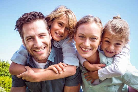 Happy Parents With Their Children