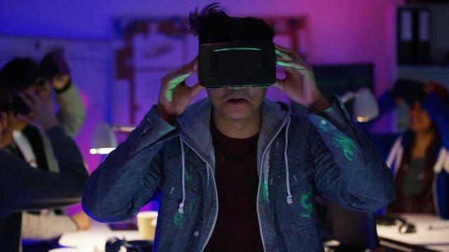  Young computer programmers trying out virtual reality viewers
