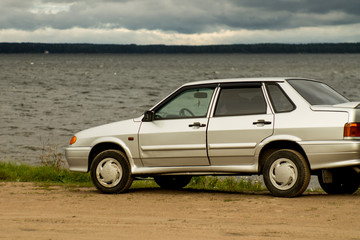 Obraz na płótnie Canvas silver car on the rural road