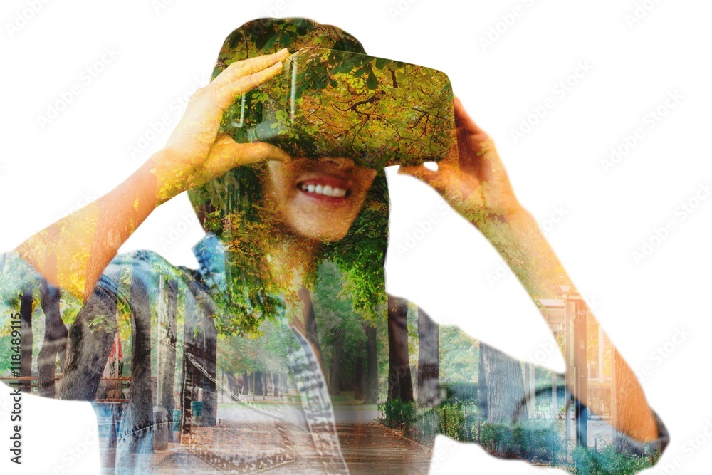 Wall mural Composite image of woman using an oculus