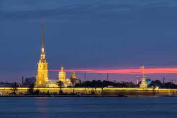 Fototapeta na wymiar Night view on the illuminated Peter and Paul Fortress and Neva River, St. Petersburg, Russia.