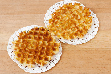 Waffles on a wooden background. Breakfast, dessert.