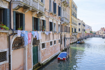 Venice, Italy, June, 21, 2016: landscape with the image of boats on a channel in Venice, Italy