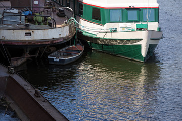Fototapeta na wymiar old rusty boats moored on the river