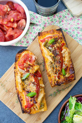 Grilled open faced sandwich with tomato, olives, cheese and chic