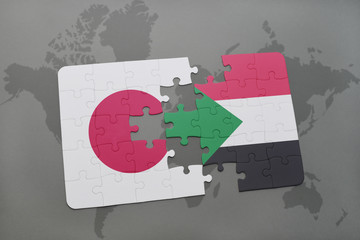 puzzle with the national flag of japan and sudan on a world map background.