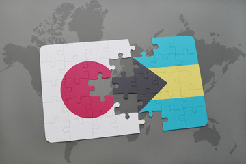 puzzle with the national flag of japan and bahamas on a world map background.