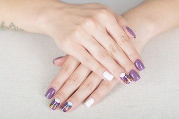 Obraz na płótnie Canvas Bright stylish manicure with colored nail gel polish