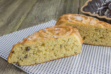 Sliced raisin walnut cake in the shape of a heart with a ceramic