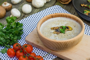 Creamy Champignon Soup in Wooden Bowl with Sautéed Champignon M