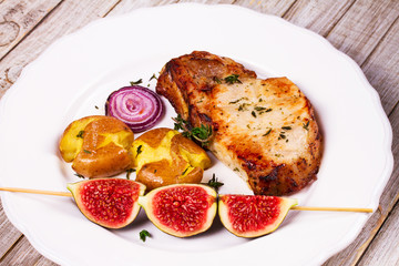 Roasted Pork Chop with Figs, Baked Potato, Red Onion and Thyme