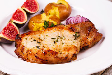 Roasted Pork Chop with Figs, Baked Potato, Red Onion and Thyme