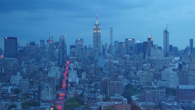 NEW YORK - Circa, August, 2016 - A dramatic day to night time lapse over midtown Manhattan while a thunderstorm rolls in over the Empire State Building.  	