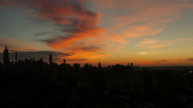 A dramatic sunrise timelapse shot over Midtown Manhattan.  	