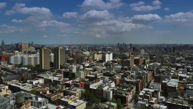 A dramatic summer day time lapse of puffy clouds passing over Midtown Manhattan.  	