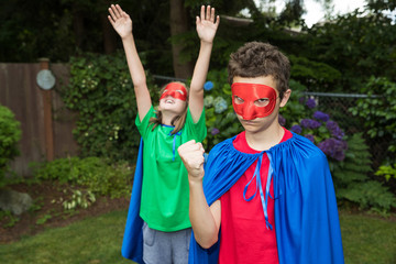 Superhero duo in cape and mask